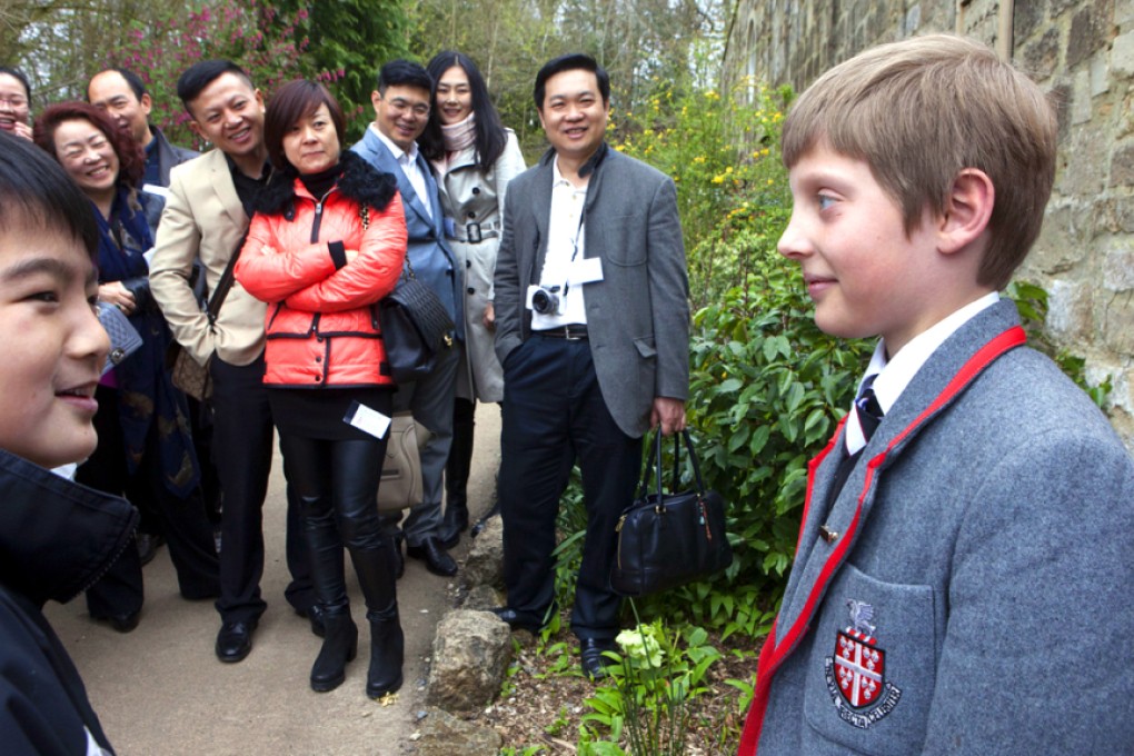 Parents from China, looking for a private education for their children in the UK, look around Kingswood school in Bath and meet the head boy of the prep school. Photo: China Foto Press