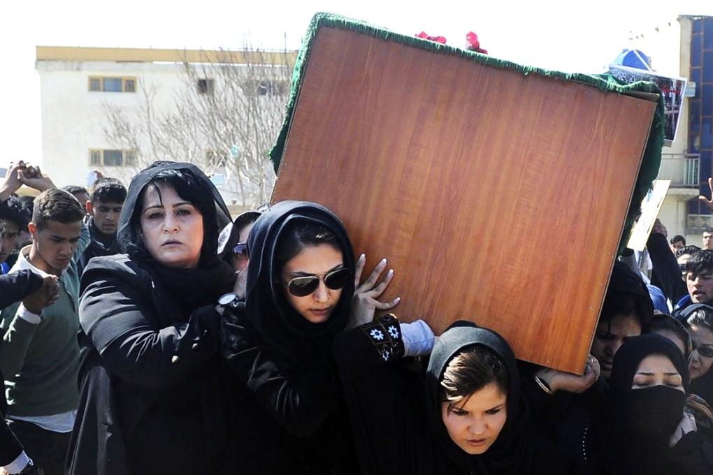 Women carry Farkhunda's coffin at her funeral. Photo: EPA