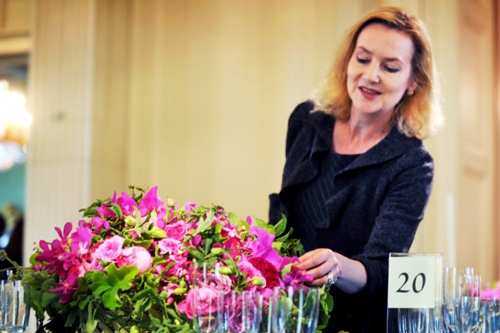 Laura Dowling, shown preparing an arrangement at the White House in May 2010, became chief florist in 2009. Photo: The Washington Post/Bill O'Leary