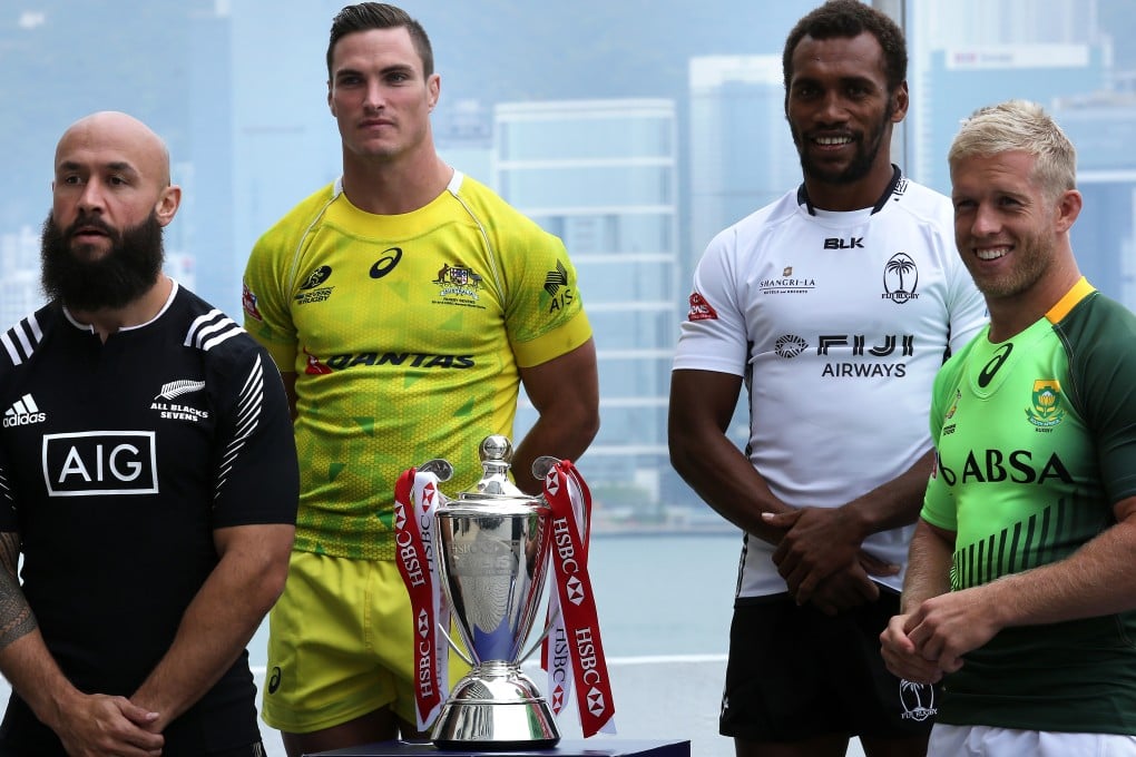Captains of the top four teams in the World Series standings (from left) DJ Forbes of New Zealand (second place), Ed Jenkins of Australia (fourth), Osea Kolinisau of Fiji (third) and Kyle Brown of South Africa (first) with the Hong Kong Sevens Cup on Wednesday. Photo: Jonathan Wong/SCMP