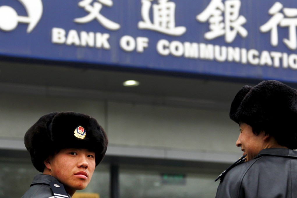 Guards outside a BOCOM bank branch in China. Photo: Reuters