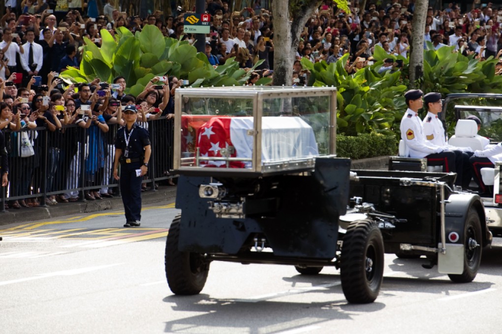 A military gun carriage carrying the coffin of Singapore's founding father Lee Kuan Yew travels towards Parliament House yesterday. Photo: Xinhua