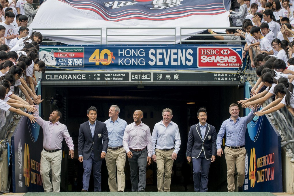 Waisale Serevi (left) is enthusiastically greeted by youngsters along with Gavin Hastings (third left), George Gregan, Jonathan Davies and Brian O'Driscoll. Photo: SCMP Pictures