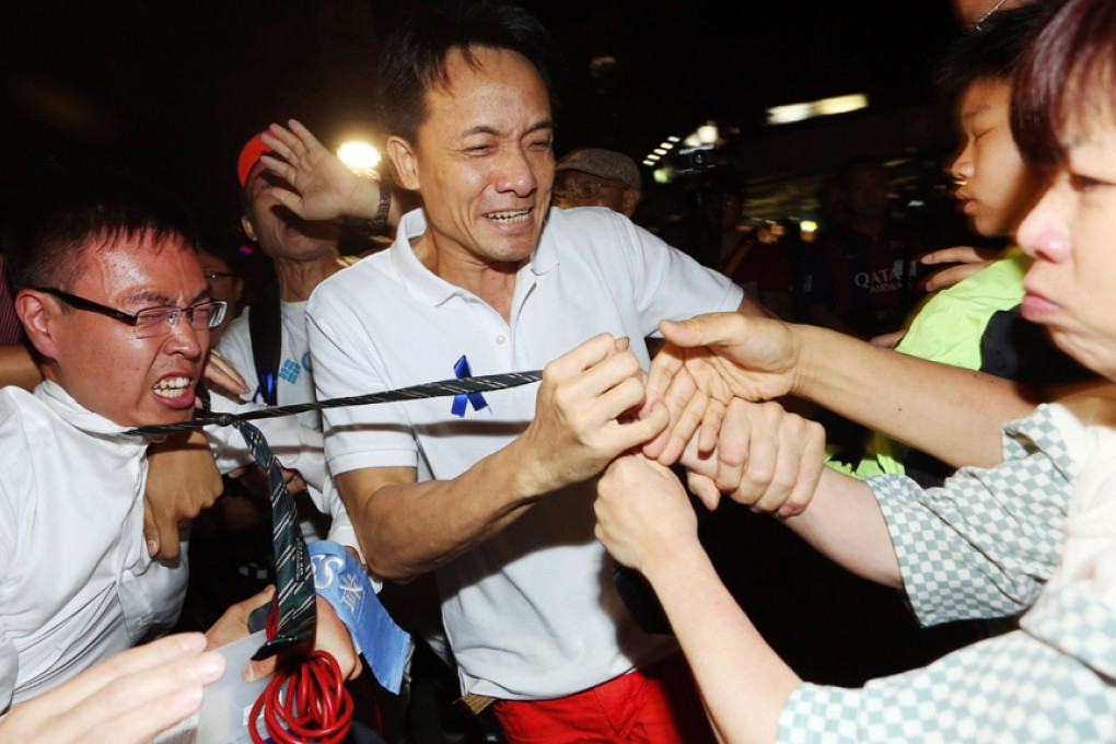 A TVB Journalist came under attack during a rally organised by Blue Ribbon Movement in Tsim Sha Tsui in October, 2014. Photo: SCMP Pictures