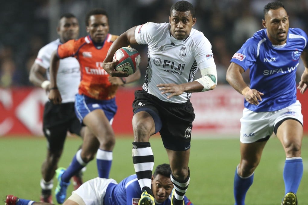 Fiji's Samisoni Viriviri skips out of a Samoan tackle and charges up the field on Friday at the Sevens. Photo: Felix Wong/SCMP