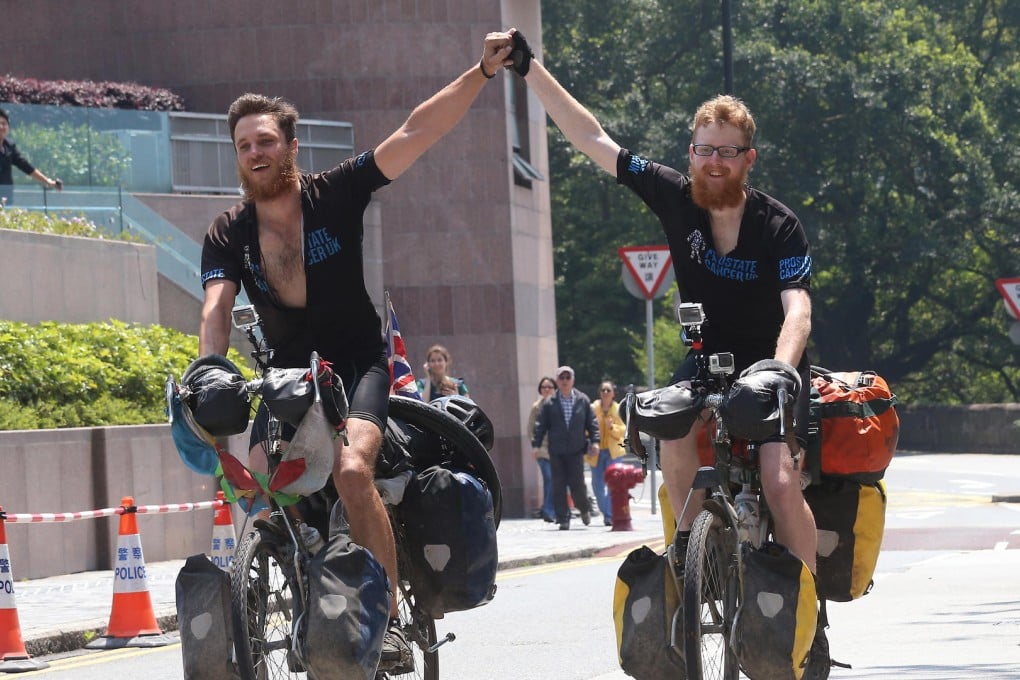 Britons Nick Codrington, 24, and Laurence Gribble, 23, make it to The Peak yesterday. Photo: David Wong