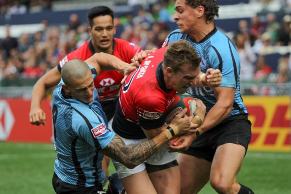 Hong Kong hero Alex McQueen forces his way through the Uruguay defence to score the second of his two tries in Saturday’s 19-7 pool victory. Photos: Nora Tam/SCMP