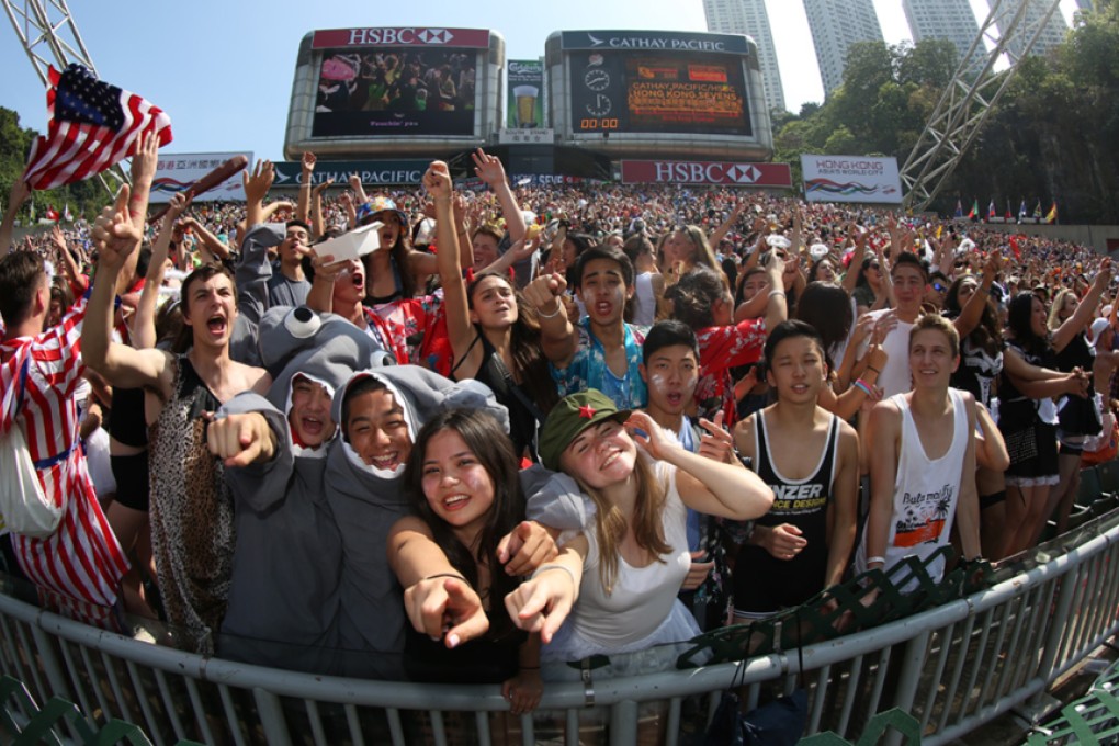 Fans in the South Stand show their party credentials on Saturday at the 2015 Cathay Pacific/HSBC Hong Kong Sevens. Photo: Nora Tam/SCMP