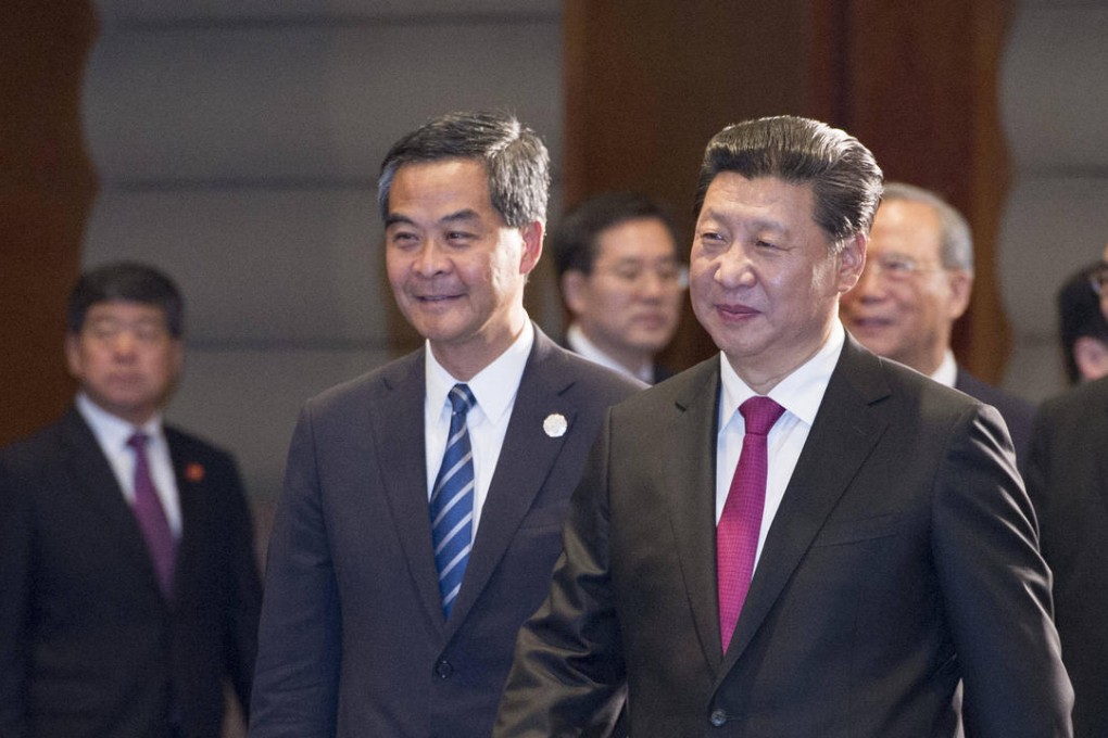 Xi Jinping (centre) and Leung Chun-ying (left) at the Boao Forum.