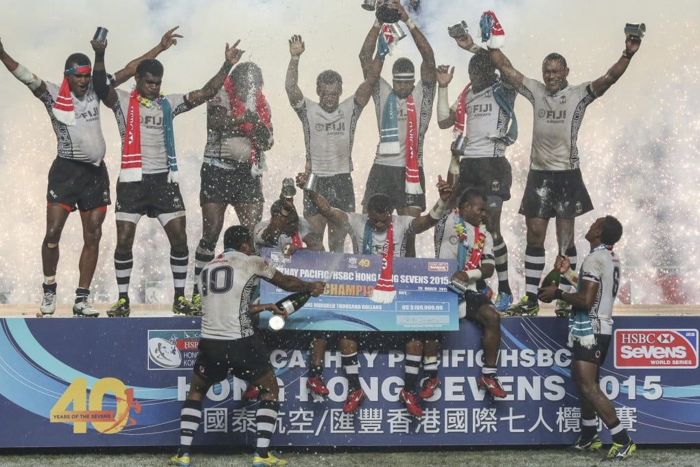 The bubbly flows as the outstanding Fiji squad celebrate their victory over New Zealand in the Cup final at the Hong Kong Sevens. Photo: Sam Tsang/SCMP