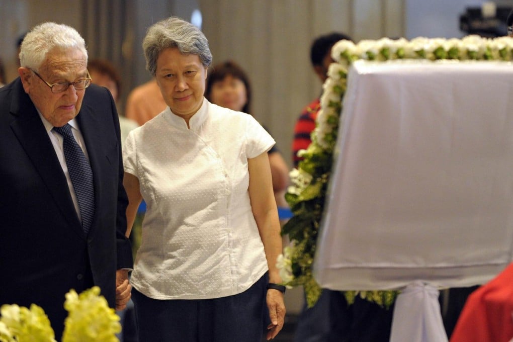 Henry Kissinger, the former US secretary of state, and Ho Ching, wife of Singaporean PM Lee Hsien Loong, at Parliament House yesterday. Photo: AFP