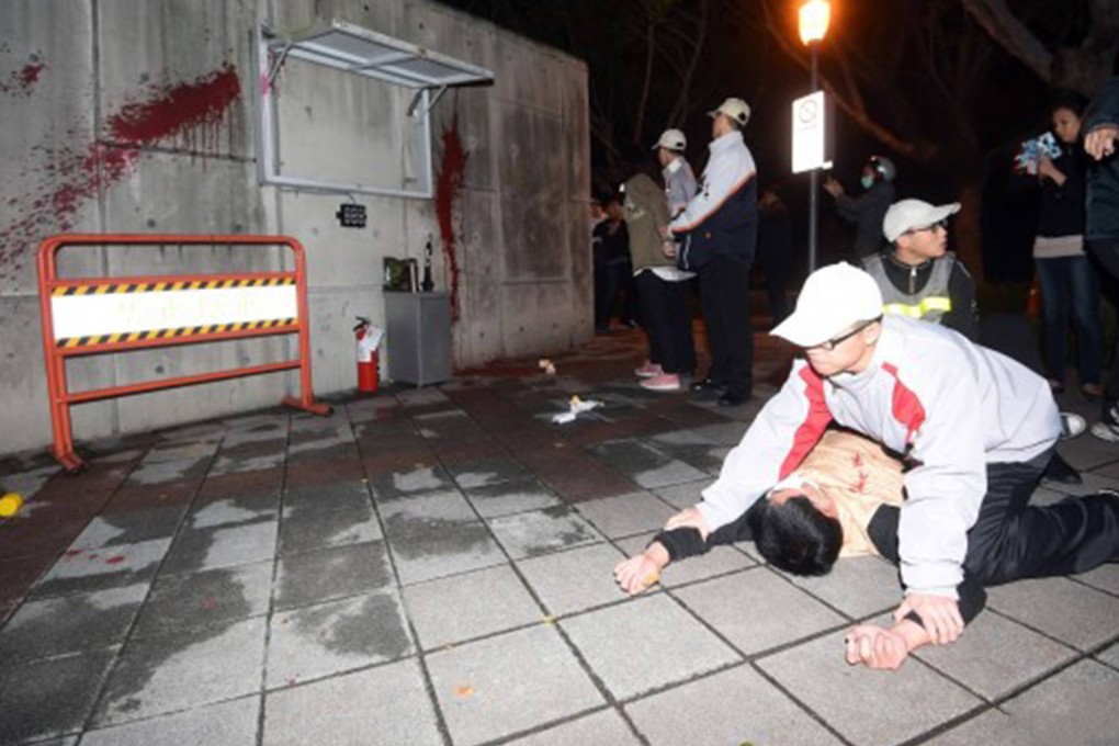 Taiwan police arrest a protester yesterday. Photo: SMP