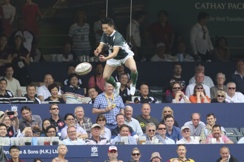 A Kung Fu Rugby team member's aerial stunt wows the Sunday crowd at the Hong Kong Sevens. Photo: Felix Wong