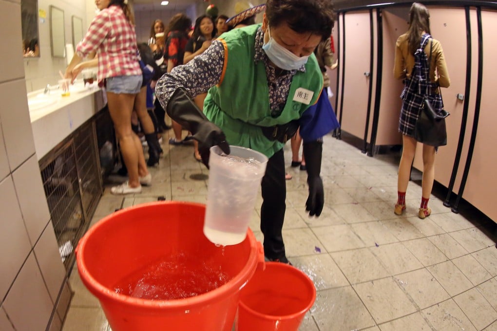 People have to flush the toilet using buckets at the Hong Kong Sevens. Photo: Nora Tam/SCMP