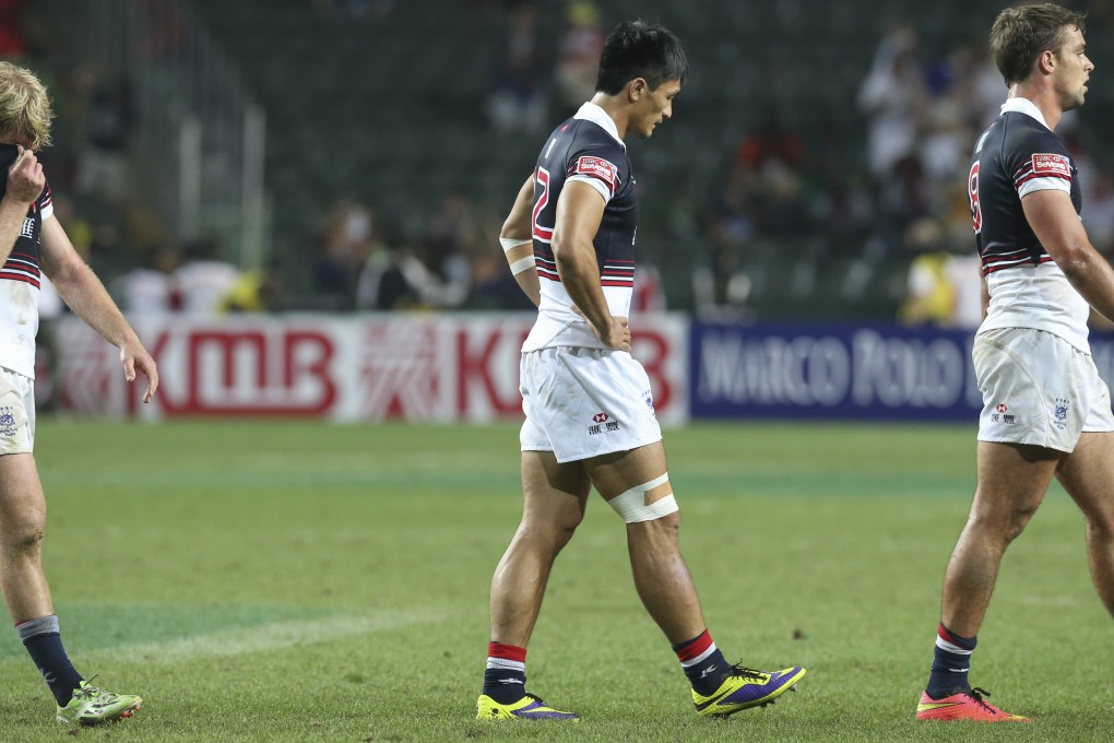 Jamie Hood, Salom Yiu Kam-shing and Chris Maize trudge off after Hong Kong crash out of contention in the battle to win core status on the Sevens World Series. Photo: KY Cheng/SCMP