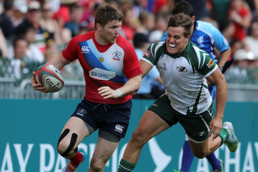 Yury Gostyuzhev slips a tackle during the qualifier final before running in to score one of four Russia tries in their 22-19 triumph over Zimbabwe. Photo: Sam Tsang/SCMP
