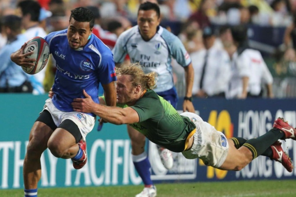 Samoa’s Samoa Toloa slips a committed Werner Kok tackle during Sunday’s Hong Kong Sevens third-place play-off match won by South Africa. Photos: KY Cheng/SCMP