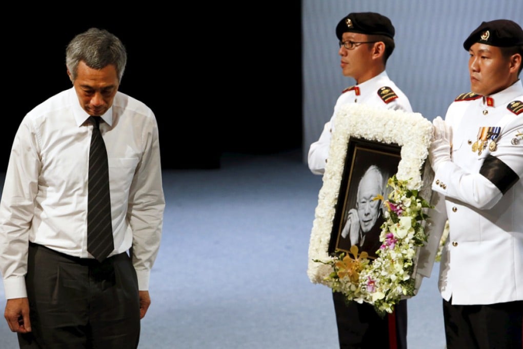 Singapore's Prime Minister Lee Hsien Loong as the casket of his father and former leader Lee Kuan Yew is carried off during the funeral service. Photo: Reuters