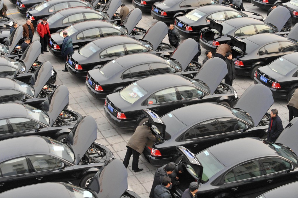 A fleet of government cars and drivers wait to take delegates to the National People's Congress in Beijing four years ago, before the curbs on wasteful spending were introduced. Photo: AFP