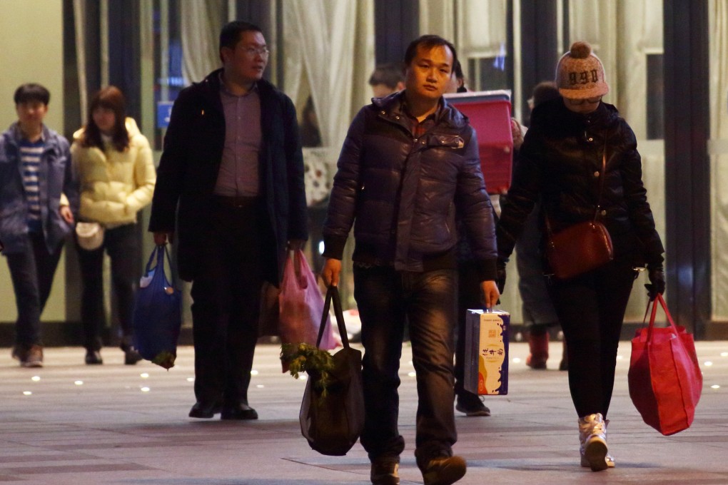 Shoppers at a mall in Beijing. Photo: Bloomberg