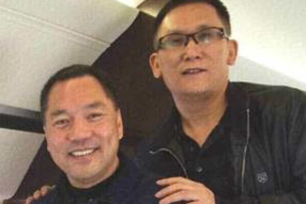 An undated photo posted on a microblog on Monday shows Beijing Zenith’s Guo Wengui (left) and Founder Group’s Li You on a private jet. Photo: SCMP Pictures