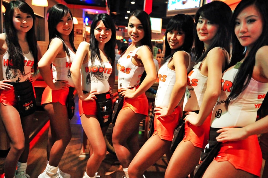 Staff at a Hooters restaurant in Beijing. The restaurant chain has plans for five shops across Hong Kong. Photo: AFP
