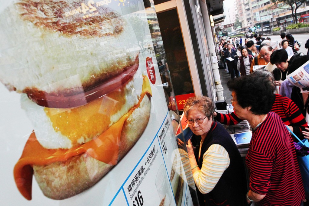 McDonald's lovers queue for free McMuffins in Hong Kong during a 2013 promotion. Photo: Felix Wong