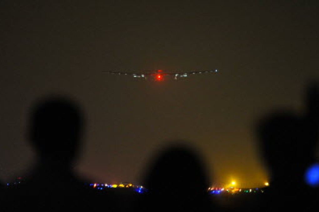 The Solar Impulse 2 prepares to land in Chongqing early on Tuesday. Photo: Xinhua
