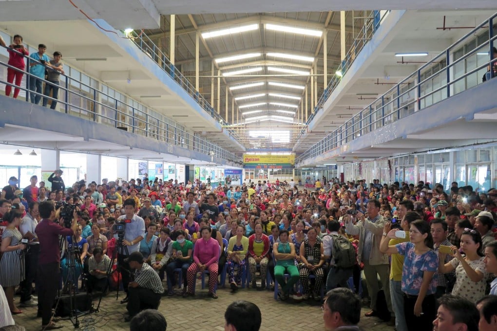 Workers of Pou Yuen Vietnam gather for talks.Photo: Reuters
