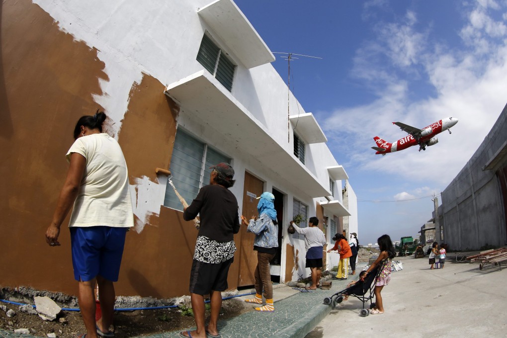 Philippine government expects economic growth of 7 to 8 per cent this year, after 6.1 per cent expansion in 2014. Photo: EPA