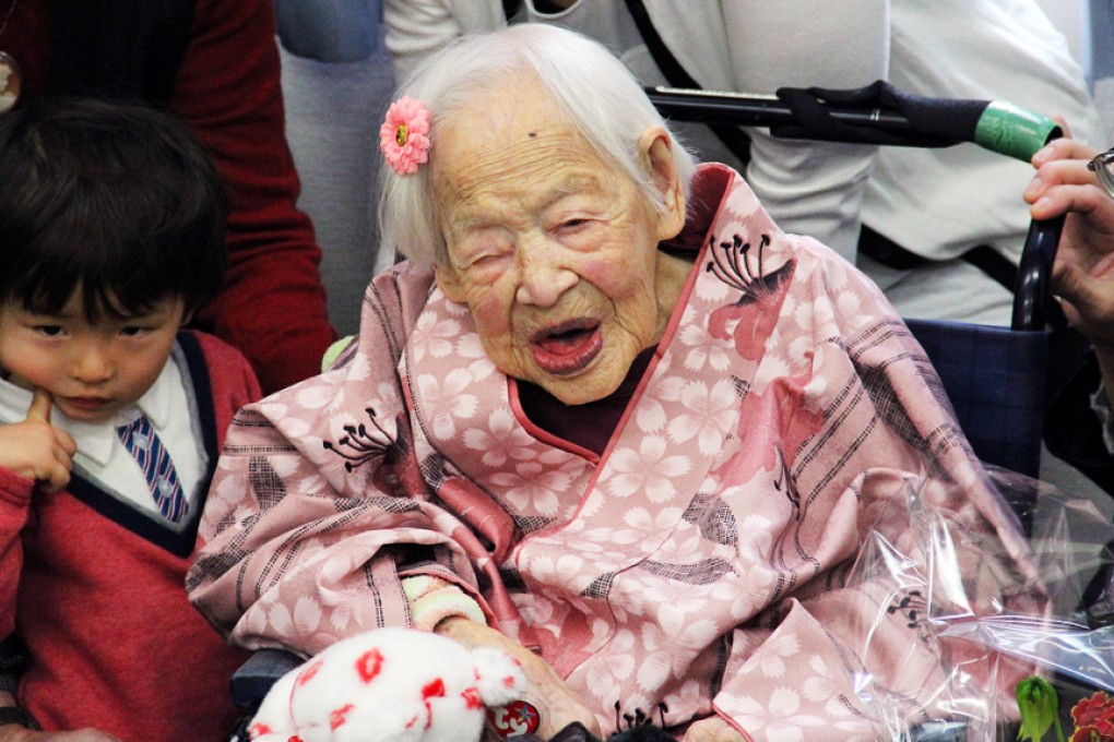 Misao Okawa (centre), was named the world's oldest person in 2013 when she turned 114. Photo: EPA