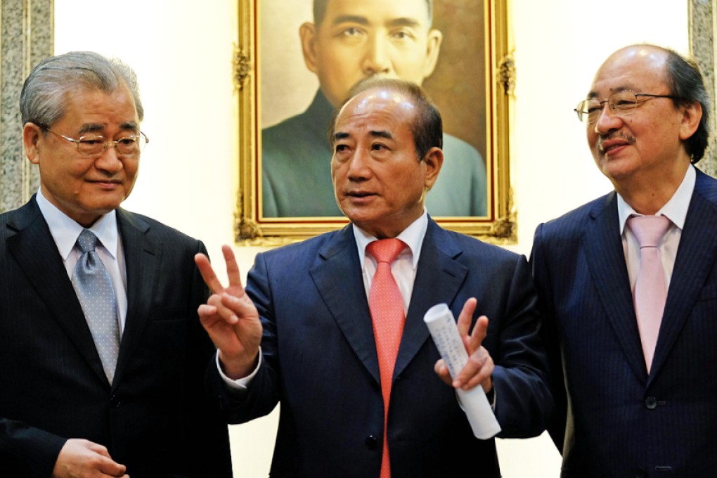 Taiwan's Parliament speaker Wang Jin-pyng, centre, with Premier Mao Chi-kuo, left, and Democratic Progressive Party (DPP) member Ker Chien-ming, right, in Taipei on Wednesday. Taipei sent a letter of intent to join the Beijing-led Asian Infrastructure Bank on Tuesday. Photo: AFP