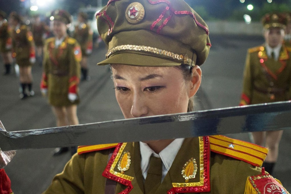 Dancer Ri Hyang-yon takes part in a practice session for the Arirang mass games in a car park in Pyongyang.