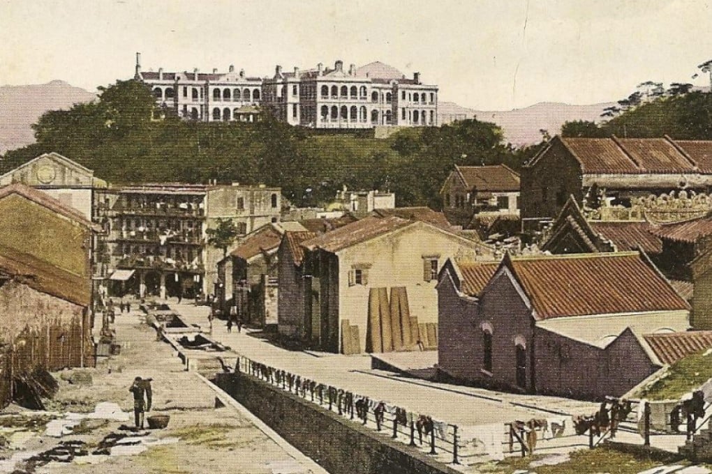 Washing dries on railings on Stone Nullah Lane, circa 1910.