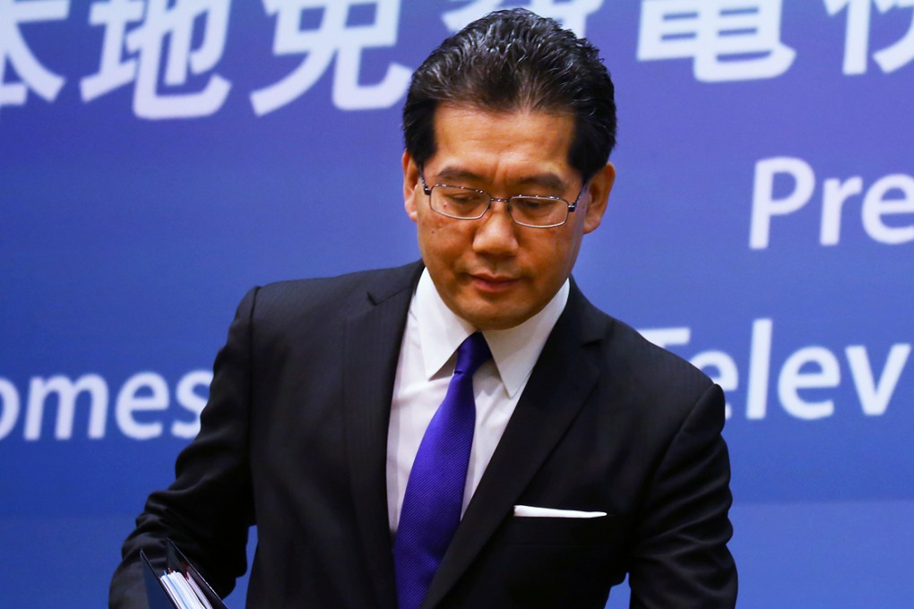 Gregory So Kam-leung speaks on domestic free television programme service licences at a press conference held at Central Government Offices. Photo: Nora Tam