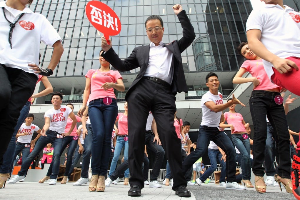 ATV investor Wong Ching dances outside Legco in protest against new licences. Photo: Felix Wong