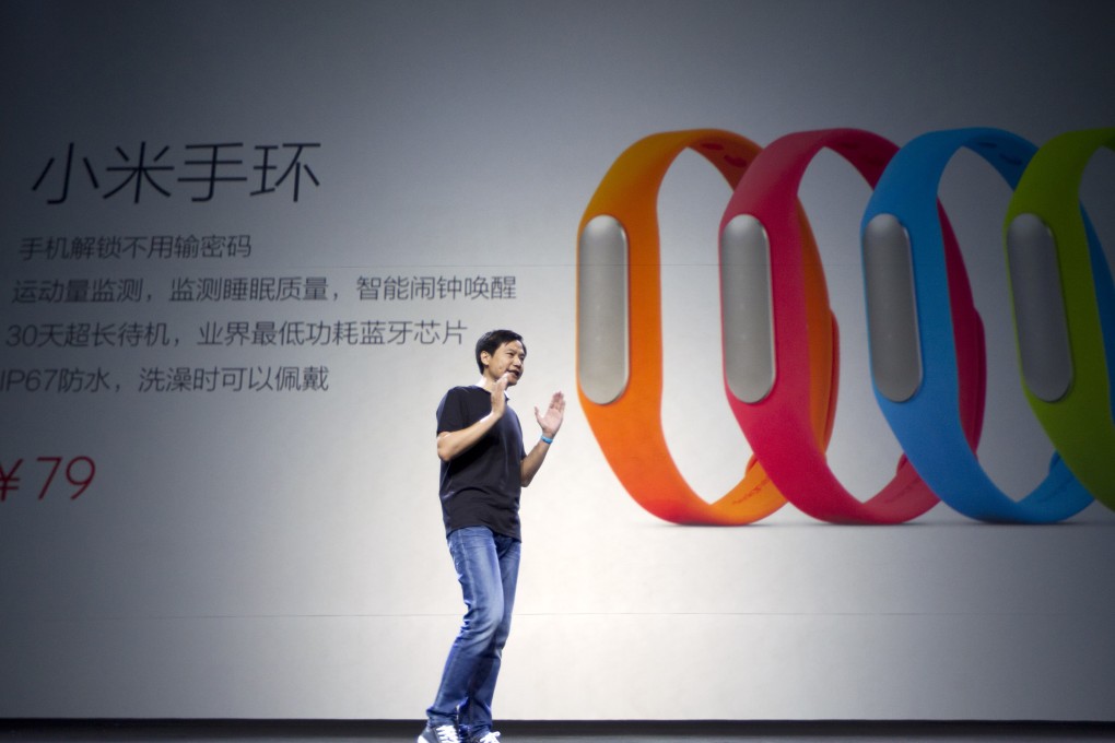 Lei Jun, CEO of XIAOMI introduces the company's lowed-priced smart wristband in Beijing in July, 2014. Photo: Simon Song