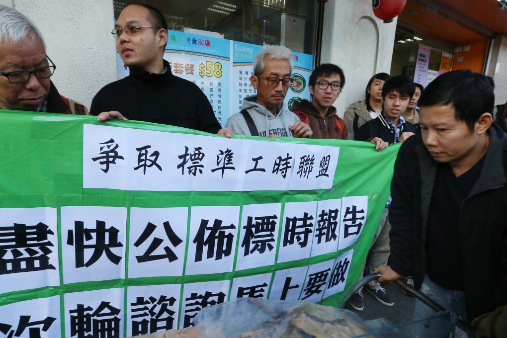 Labour group representatives demanding working hours legislation at a rally earlier this year. Photo: K. Y. Cheng
