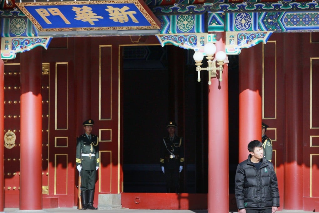 Armed police guard the formal entrance to Zhongnanhai, the Communist Party's headquarters, in Beijing. The CCDI is sending teams to keep watch on several key party bodies. Photo: Simon Song