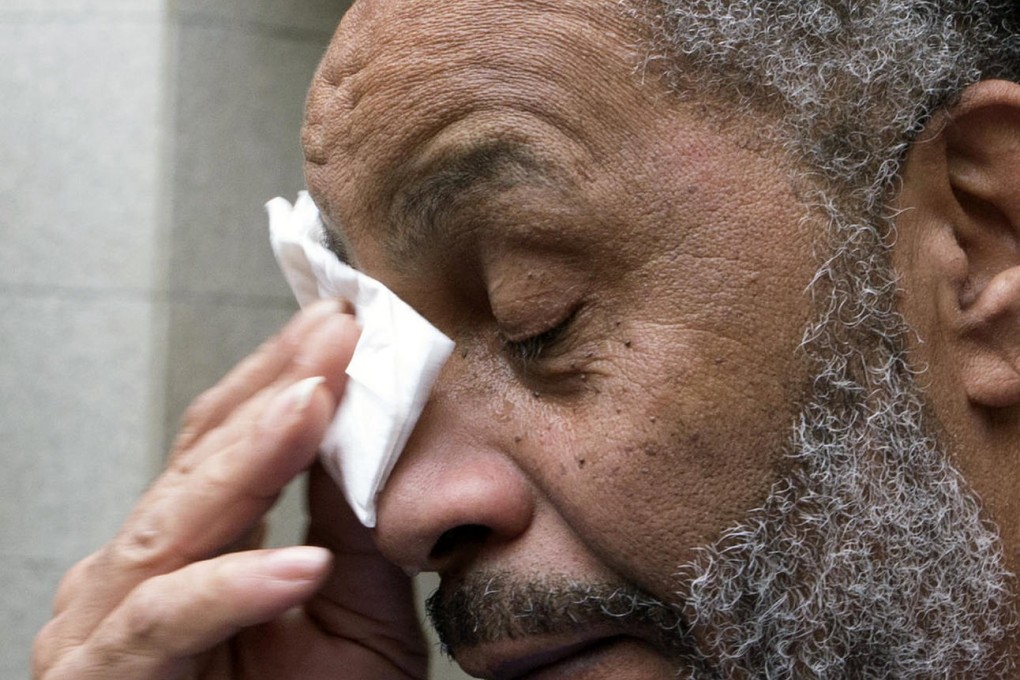Anthony Ray Hinton wipes away tears outside the Jefferson County jail after his exoneration.Photo: AP