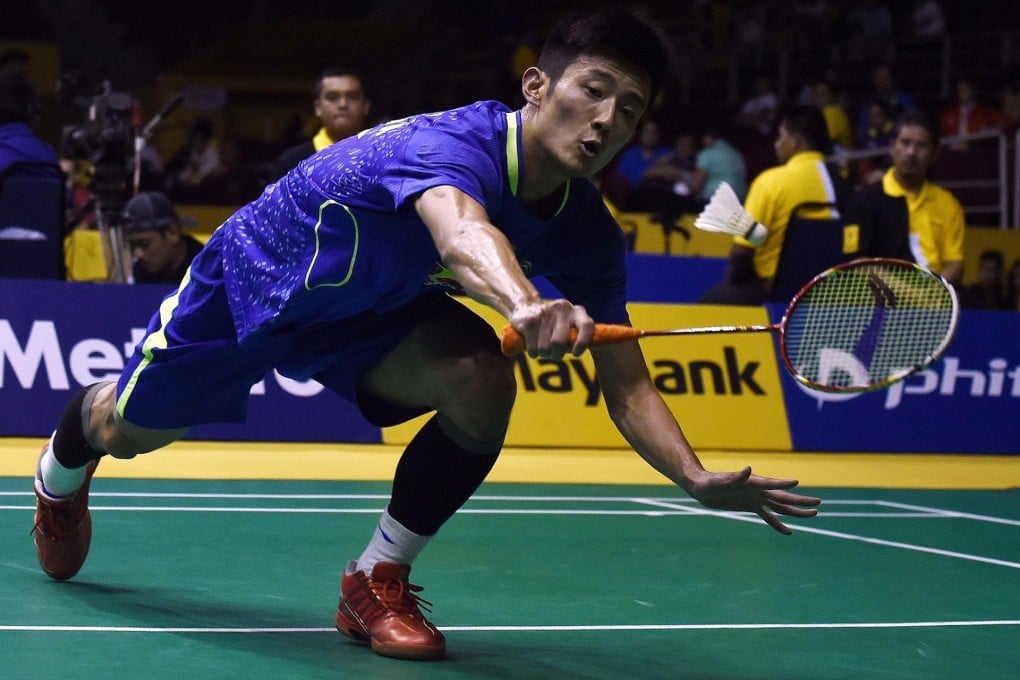 Chen Long reaches to hit a shot against Wang Zhengming. Photo: AFP
