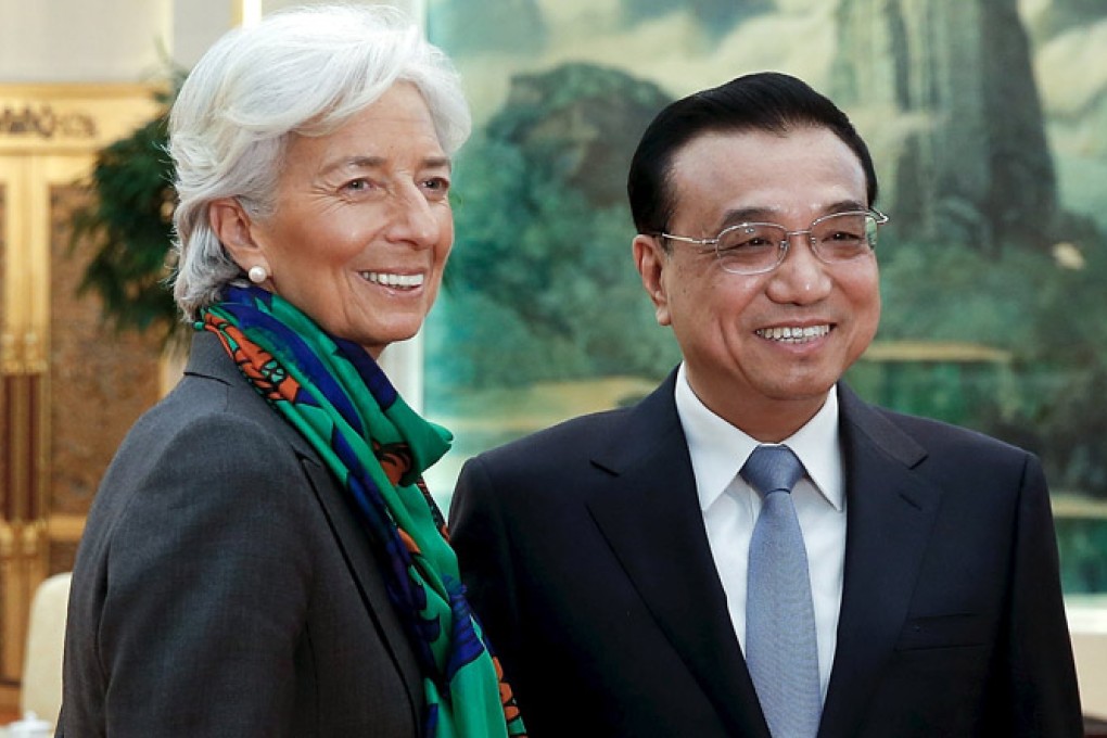 Chinese Premier Li Keqiang (right) meets IMF chief Christine Lagarde last month. A Chinese official says China's pet project, the AIIB regional bank, will complement other financial institutions. Photo: Reuters