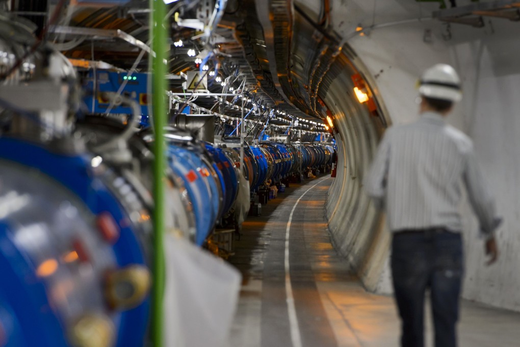 A scientist walking in a tunnel inside the European Organisation for Nuclear Research (CERN) Large Hadron Collider (LHC) in Meyrin, near Geneva. Photo: AFP