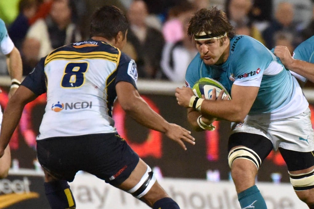 Cheetahs flanker Boom Prinsloo charges towards Brumbies No 8 Jarrad Butler during their Super 15 clash in Canberra. Photos: AFP