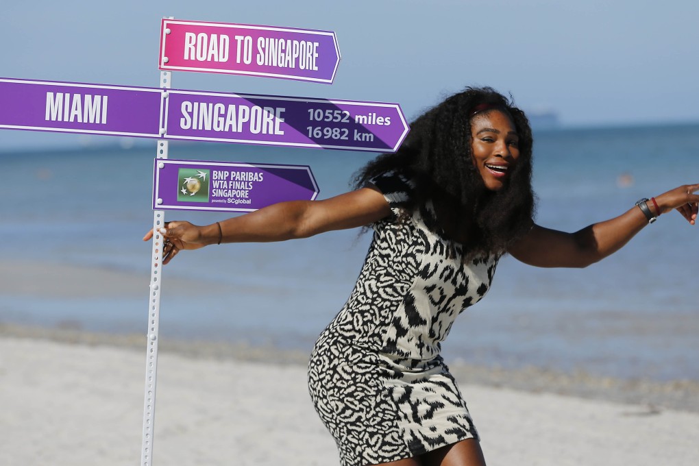 Serena Williams poses with the road to Singapore sign post on Crandon Park beach after her straight-sets victory over Carla Suarez Navarro in the Miami Open. Photo: USA Today Sports