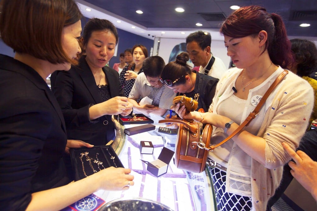 Sales of luxury goods on the mainland slipped by 1 per cent last year as more wealthy Chinese consumers chose to do their shopping abroad. Photo: EPA