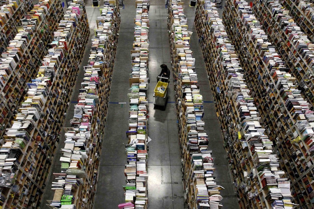 Worker gathers items for delivery at Amazon's distribution centre in Phoenix, Arizona. The US e-commerce market has overtaken China's in an annual ranking. Photo: Reuters