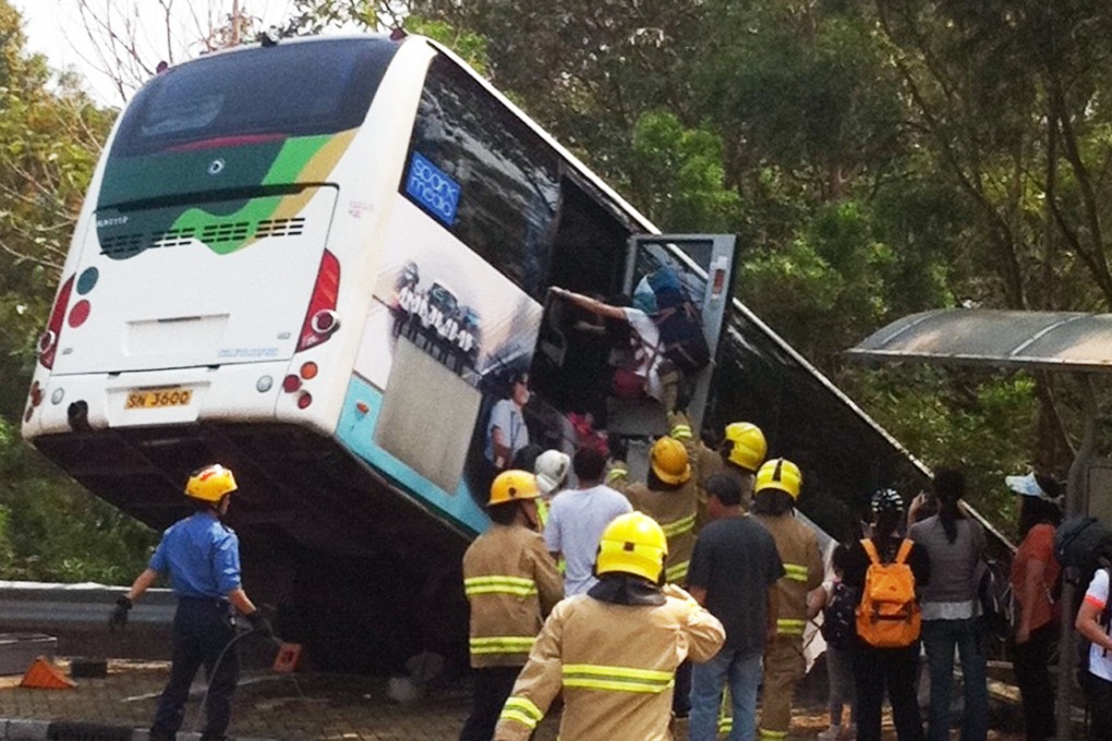 The bus mounted the pavement and was only stopped by trees after crashing through a road safety barrier. Photo: SCMP Pictures