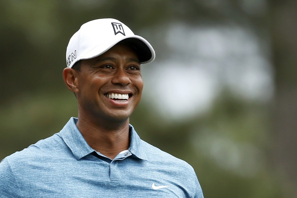 Tiger Woods smiles during his practice round. Photo: Reuters