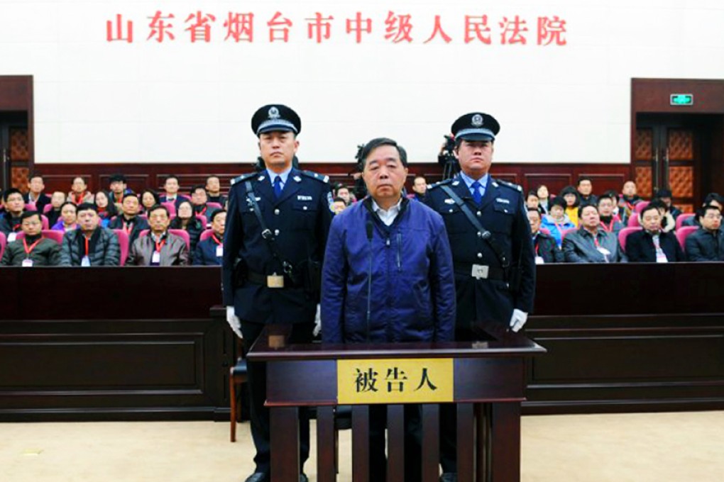 Former Nanjing mayor Ji Jianye stands trial at the Yantai Intermediate People's Court. Photo: Xinhua